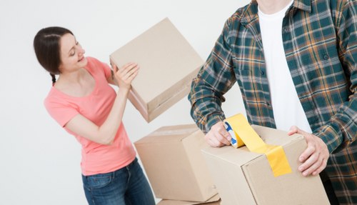 Team arranging household items during packing and unpacking services in Monument