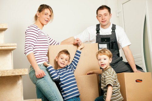 Professional movers transporting boxes near Monument