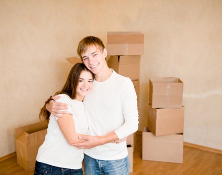 Organized moving boxes labeled by room for efficient unpacking in Monument